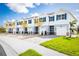 New townhouses with attached garages and well-manicured landscaping at 12466 Amber Creek Cir, Lakewood Ranch, FL 34211