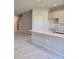 Kitchen island with white cabinets and quartz countertops at 12466 Amber Creek Cir, Lakewood Ranch, FL 34211