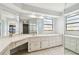 Bathroom with double vanity and large mirror at 1314 Vermont Ave, Tarpon Springs, FL 34689