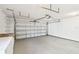 Bright garage with ample storage and workbench at 1314 Vermont Ave, Tarpon Springs, FL 34689