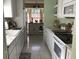 Well-equipped kitchen with white cabinets and island at 13219 Greenview Ct, Hudson, FL 34669