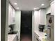 Bright kitchen with white cabinets and granite countertops at 13219 Greenview Ct, Hudson, FL 34669