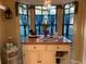 Kitchen island with wood top and bay window view at 13219 Greenview Ct, Hudson, FL 34669