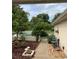 Landscaped side yard with walkway and fountain at 13219 Greenview Ct, Hudson, FL 34669