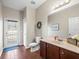 Bathroom with a single sink vanity and a toilet at 14143 Wake Robin Dr, Brooksville, FL 34604