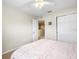 Bright bedroom with a ceiling fan and double door closet at 14143 Wake Robin Dr, Brooksville, FL 34604