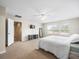 Bright bedroom with a comfortable bed and window views at 14143 Wake Robin Dr, Brooksville, FL 34604