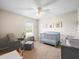 Charming Bedroom with crib, seating and natural light at 14143 Wake Robin Dr, Brooksville, FL 34604