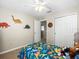 Dinosaur-themed bedroom with a full-size bed and closet at 14143 Wake Robin Dr, Brooksville, FL 34604