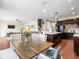 Kitchen features island, dark cabinets, and stainless steel appliances at 14143 Wake Robin Dr, Brooksville, FL 34604