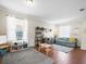 Living room with hardwood floors, couch, and a play area at 14143 Wake Robin Dr, Brooksville, FL 34604