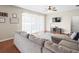 Comfortable living room with sectional sofa and sliding glass doors at 14143 Wake Robin Dr, Brooksville, FL 34604