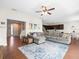Spacious living area with sectional sofa and views to entryway at 14143 Wake Robin Dr, Brooksville, FL 34604