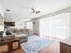 Open living area with sectional sofa and access to kitchen at 14143 Wake Robin Dr, Brooksville, FL 34604