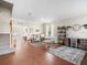 Open living space with hardwood floors, a play area, and a desk at 14143 Wake Robin Dr, Brooksville, FL 34604