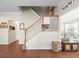 Elegant staircase with white railings leading to the upper level at 14143 Wake Robin Dr, Brooksville, FL 34604