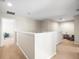 Upstairs hallway with access to bedrooms and bath at 14143 Wake Robin Dr, Brooksville, FL 34604
