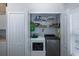 Convenient laundry room with washer and dryer included at 1764 Blue Lake Ct, Tarpon Springs, FL 34689