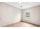 Well-lit bedroom with wood-look floors and a window at 18077 Evening Star Ave, Brooksville, FL 34604