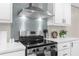 Stainless steel range and hood in a modern kitchen at 18077 Evening Star Ave, Brooksville, FL 34604