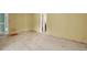 Bedroom with door to bathroom, needs flooring update at 2014 Cove Ct, Holiday, FL 34691