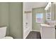 Updated bathroom with white vanity and tile shower/tub combo at 21000 Nina Ln, Brooksville, FL 34601