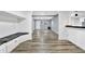 Open entryway with built-in bench seating and wood-look floors at 21000 Nina Ln, Brooksville, FL 34601