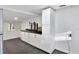Modern kitchen with white cabinets and black countertops at 21000 Nina Ln, Brooksville, FL 34601