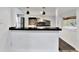 Modern kitchen with black countertops and white cabinets at 21000 Nina Ln, Brooksville, FL 34601