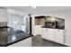 Modern kitchen with black countertops and white cabinets at 21000 Nina Ln, Brooksville, FL 34601