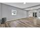 Bright living room with gray walls and wood-look floors at 21000 Nina Ln, Brooksville, FL 34601