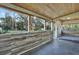 Large screened porch with wood-look walls and wood ceiling at 21000 Nina Ln, Brooksville, FL 34601