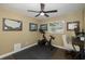 Home office with exercise bike, desk, and ample natural light at 2413 Hazelwood Ln, Clearwater, FL 33763