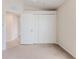 Spacious bedroom closet with double doors and neutral carpeting at 262 Hartford Ct, Spring Hill, FL 34609