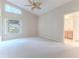 Bright bedroom with a large window and carpeted floor at 262 Hartford Ct, Spring Hill, FL 34609
