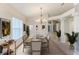 Elegant dining room, staged with table and chairs at 262 Hartford Ct, Spring Hill, FL 34609