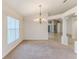 Dining room with chandelier and neutral carpeting at 262 Hartford Ct, Spring Hill, FL 34609