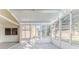 Bright enclosed patio with sliding glass doors and view at 262 Hartford Ct, Spring Hill, FL 34609
