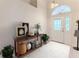 Entryway with console table, plants and decorative artwork at 262 Hartford Ct, Spring Hill, FL 34609