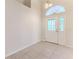 Bright entryway with tile floors and a decorative door at 262 Hartford Ct, Spring Hill, FL 34609