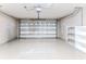 Garage with storage shelving and automatic door at 262 Hartford Ct, Spring Hill, FL 34609
