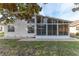 Single story home with sunroom and landscaped yard at 262 Hartford Ct, Spring Hill, FL 34609