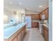 Bright kitchen with wood cabinets and white appliances at 262 Hartford Ct, Spring Hill, FL 34609