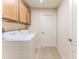Laundry room with washer, dryer and cabinets at 262 Hartford Ct, Spring Hill, FL 34609