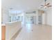 Spacious living room with tile floor, high ceilings, and view to backyard at 262 Hartford Ct, Spring Hill, FL 34609