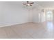 Large living room with tile flooring and ceiling fan at 262 Hartford Ct, Spring Hill, FL 34609