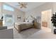 Main bedroom with wood bed frame and ensuite bathroom at 262 Hartford Ct, Spring Hill, FL 34609