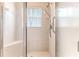 Walk-in shower with tiled walls and safety features at 262 Hartford Ct, Spring Hill, FL 34609