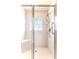 Walk-in shower with tiled walls and safety features at 262 Hartford Ct, Spring Hill, FL 34609
