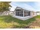 Spacious sunroom addition with screened windows and backyard access at 262 Hartford Ct, Spring Hill, FL 34609